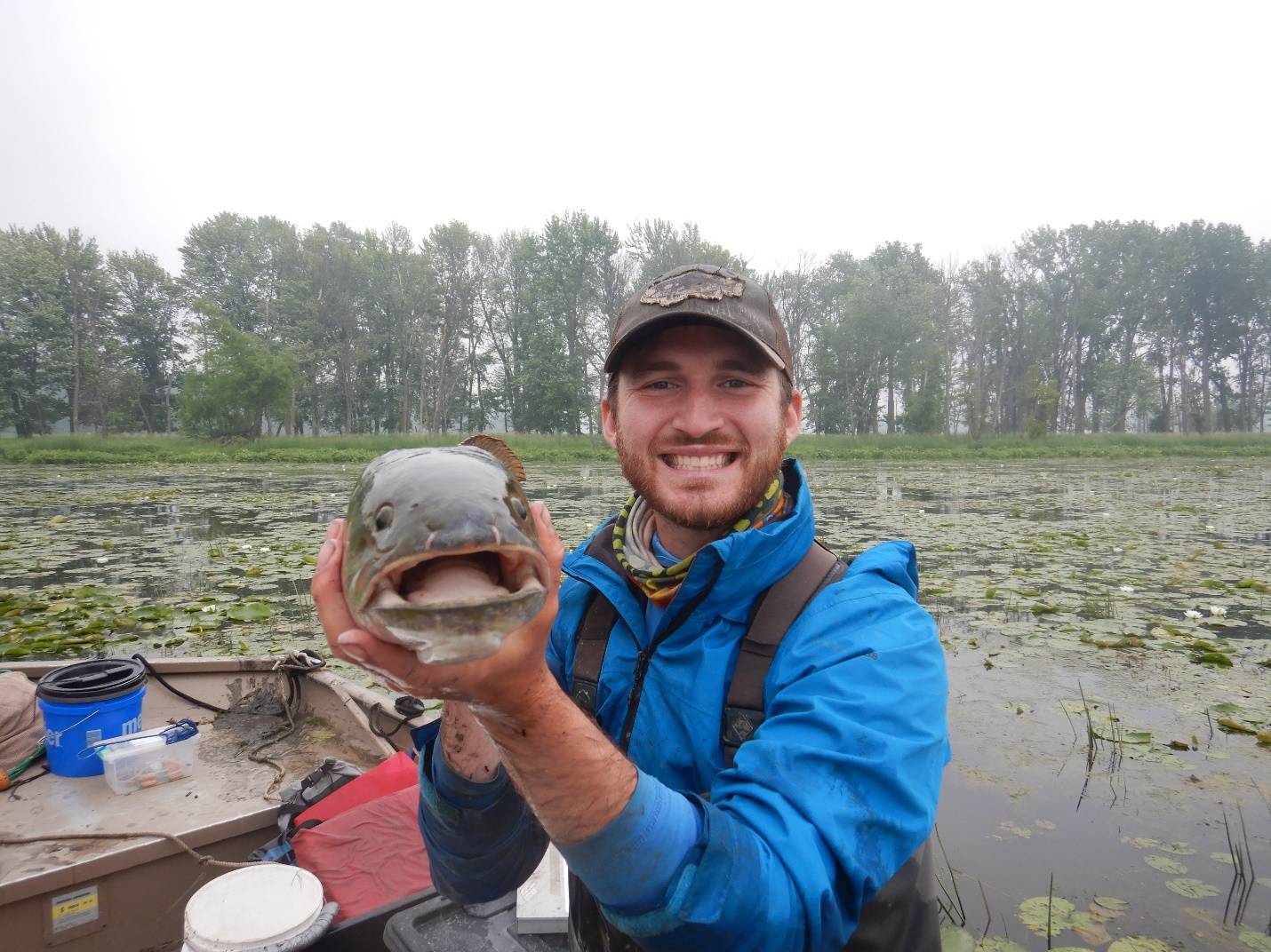 Matt Silverhart holds a fish for the camera.